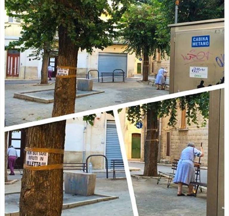 signora anziana pulisce giardino pubblico